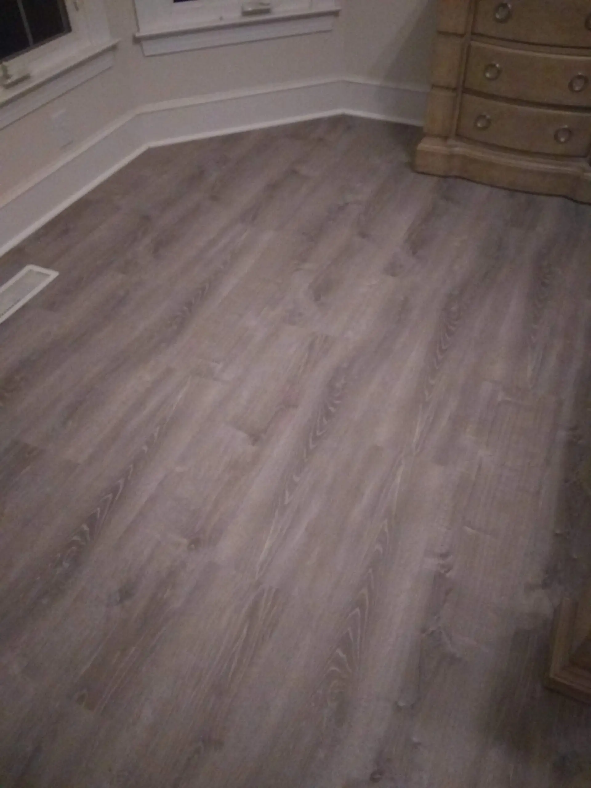 Close-up of gray oak vinyl plank flooring
