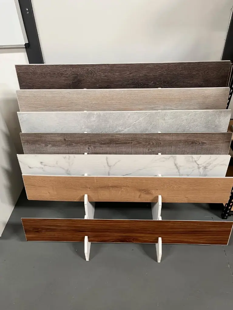 Vinyl plank flooring samples on a display rack